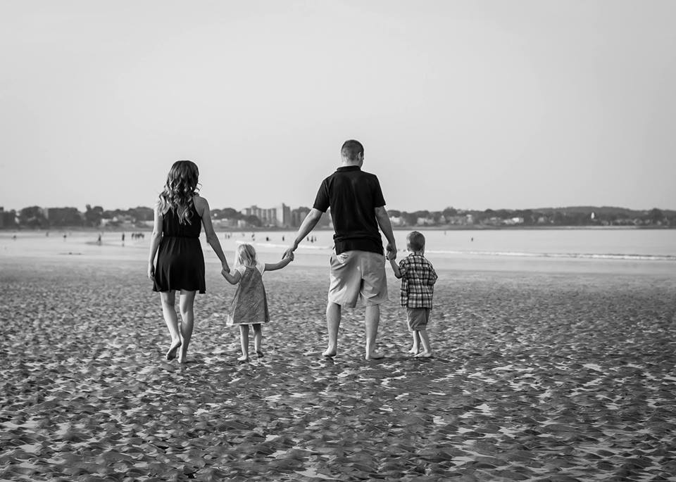 Amanda and her family enjoying a beach day.